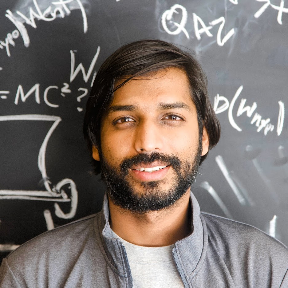 A photo of Priyank, an Indian man wearing a grey sweatshirt