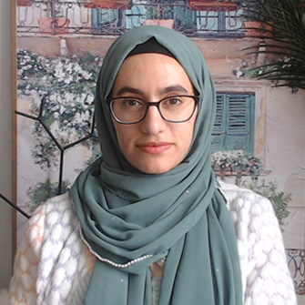 A photo of Samar, a muslim woman with a blue hijab and a white shirt